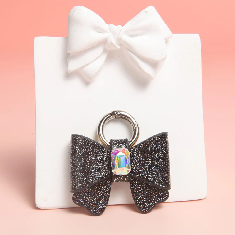 Butterfly bow charm gold ring clasp detail with heart rhinestone sparkle