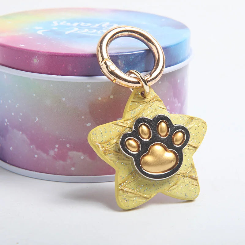 Star paw print pet tags in iridescent tin box gift packaging