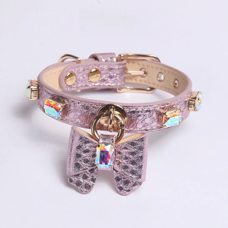 Purple AB crystal bow collar display showing gold-tone hardware