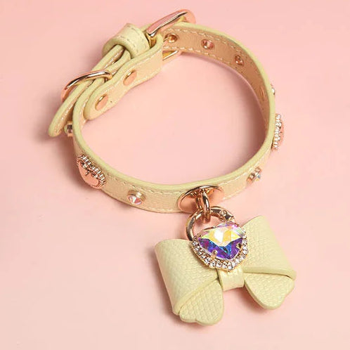 Yellow genuine leather dog collar with rhinestone studs and detachable bow charm with heart crystal