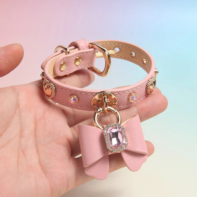 Dog wearing yellow genuine leather collar with bow charm and heart crystal pendant
