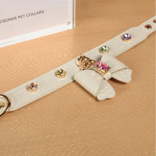 White crystal bow leather collar collection display with designer pet collars branding