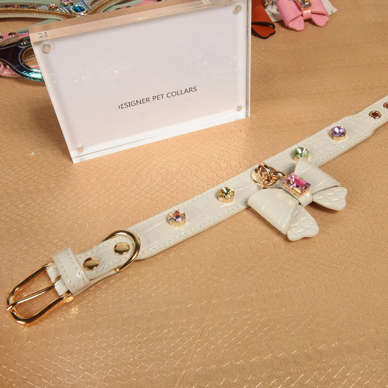 White crystal bow leather collar collection display with designer pet collars branding