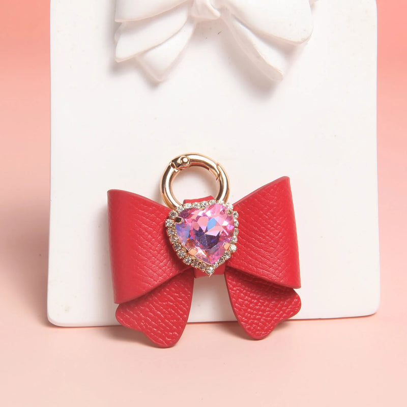 Close-up of butterfly bow charms with K9 heart-shaped rhinestone centerpieces