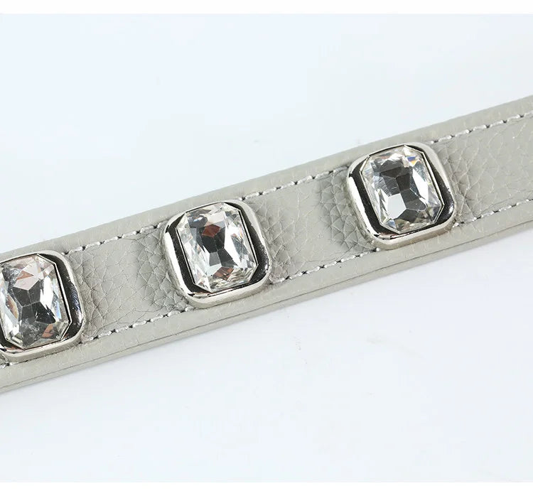 Close-up of litchi-textured leather with crystal embellishments