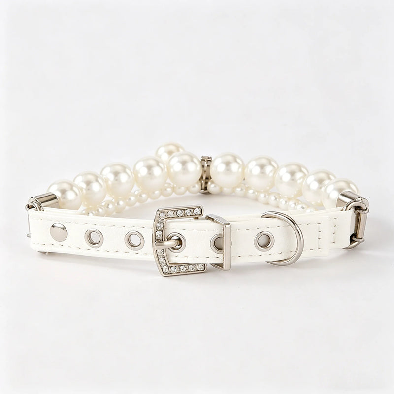 Luxury white leather dog collar featuring a double row of elegant white pearls and a sparkling silver buckle accented with rhinestones, shown on a plain white background.