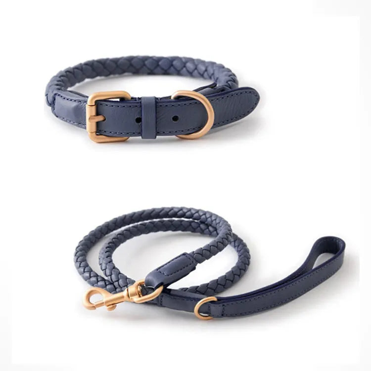 A luxury navy blue braided leather dog collar and matching leash set featuring elegant gold hardware on a clean white background.