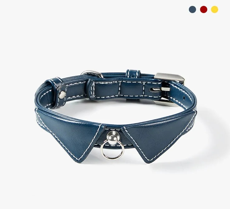 A navy blue leather pet collar featuring a unique dress shirt collar design with decorative white contrast stitching and a central silver metal ring on a plain white background.