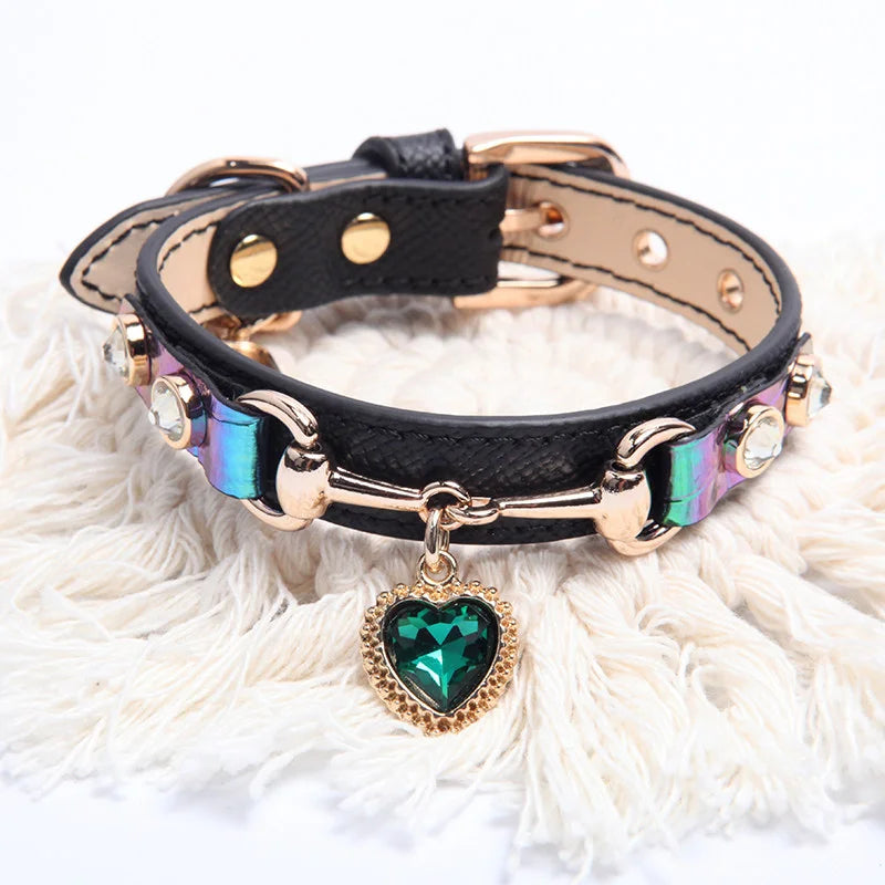 Heart-shaped crystal pendant charm with gold beaded frame detail