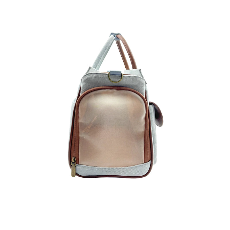 Pet carrier backpack in gray canvas with champagne gold zipper pocket and brown leather accents