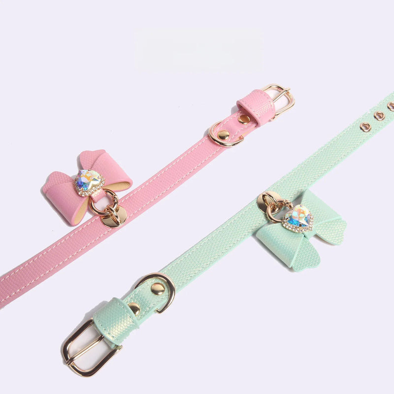Pink and mint green butterfly bow leather pet collars with heart rhinestone cross display