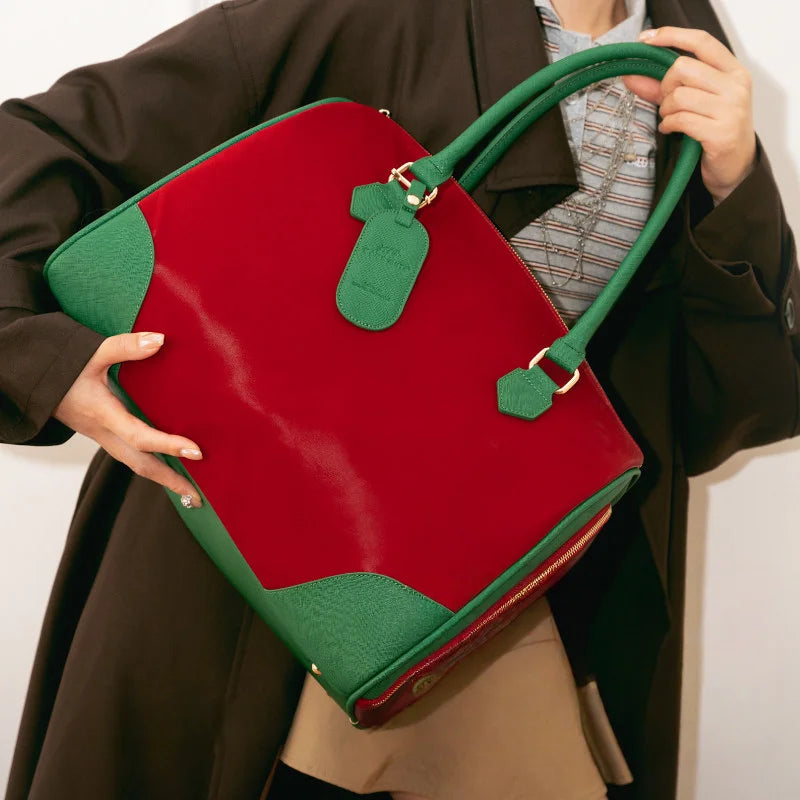 Red and green leather Boston bag with gold hardware, front view