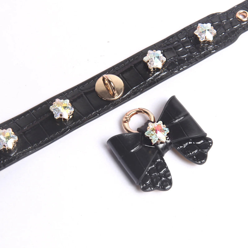 White crocodile-embossed leather collar with iridescent snowflake crystal bow charm