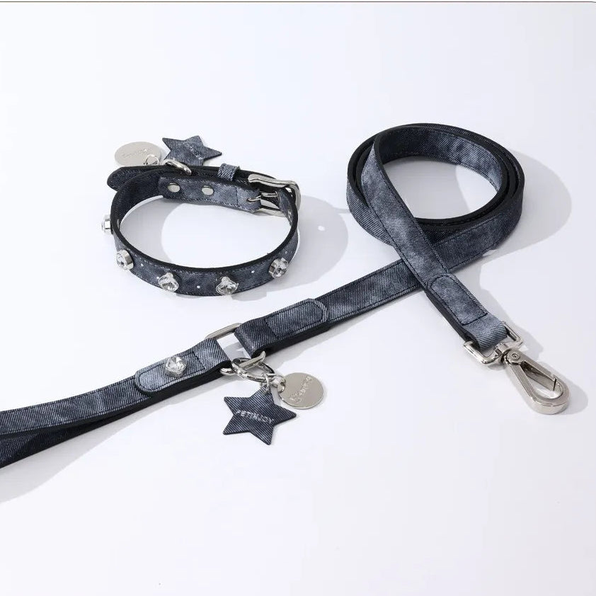 A luxurious sparkling denim dog collar and matching leash set adorned with crystal studs and silver star-shaped charms, presented against a clean white backdrop.