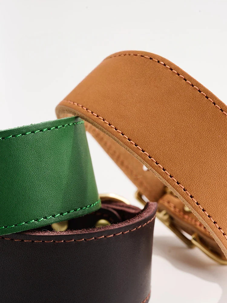 Close-up of hand-stitched leather edge and brass rivets