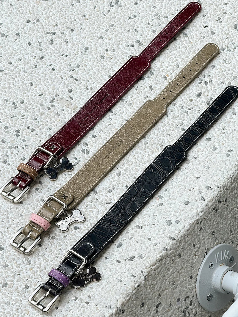 Three leather collars flat lay comparison - burgundy khaki black with accent rings